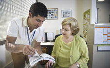 Staff member shows researcher a guide